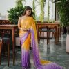 women wearing a Pink Satin Silk Party Wear Saree available online